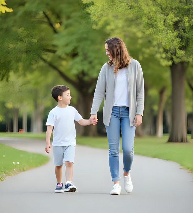 mother and her son walking down path smiling